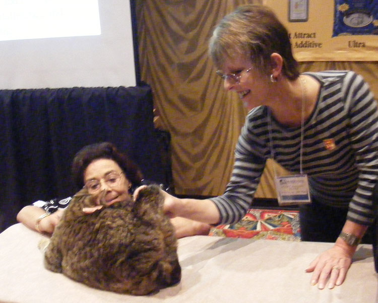 Penny Bydlinski (left) and Leslie Morgan (right) admire an example of an American Bobtail.